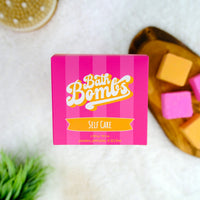 Pink box of Bath Bombs with self-care text on a white background