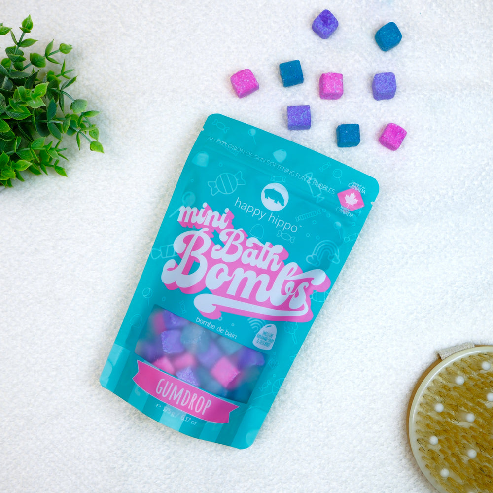 Gumdrop mini bath bombs bag with colorful bath bombs on a white surface.