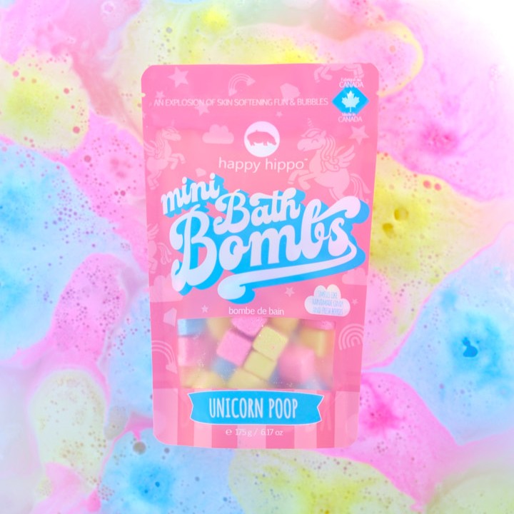 Unicorn Poop mini bath bombs with colorful water bubbling in the background