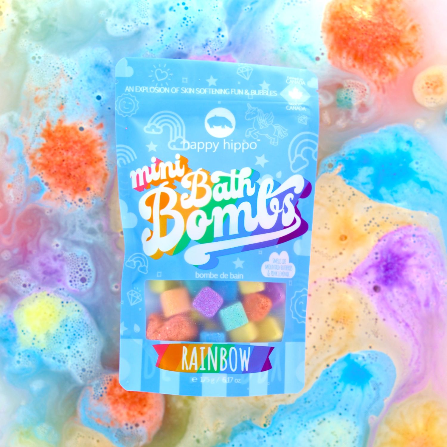 Rainbow mini bath bombs with colorful water bubbling in the background
