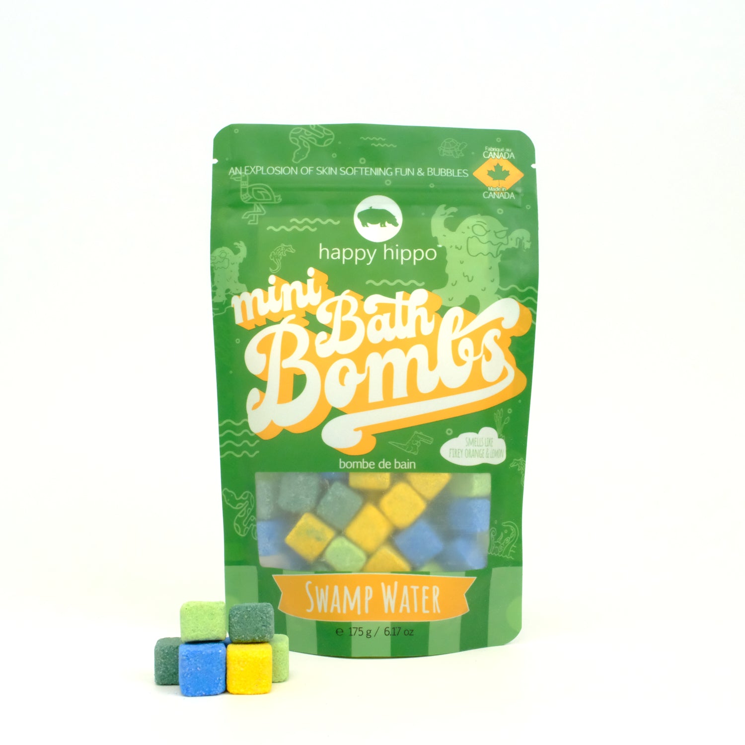 Bag of green Swamp Water Mini Bath Bombs on a white background with mini bath bombs stacked in front of it