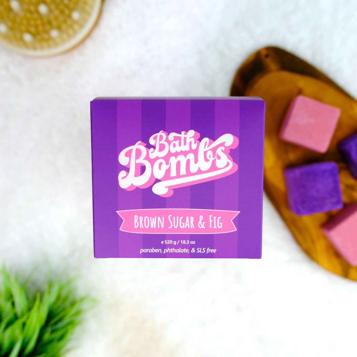 Box of Bath Bombs with 'Brown Sugar & Fig' flavor on a white surface with bath bombs.