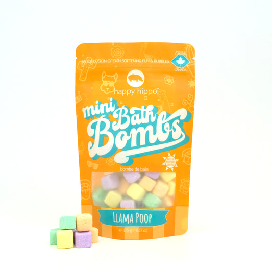 Bag of Llama Poop Mini Bath Bombs on a white background with mini bath bombs stacked in front of it