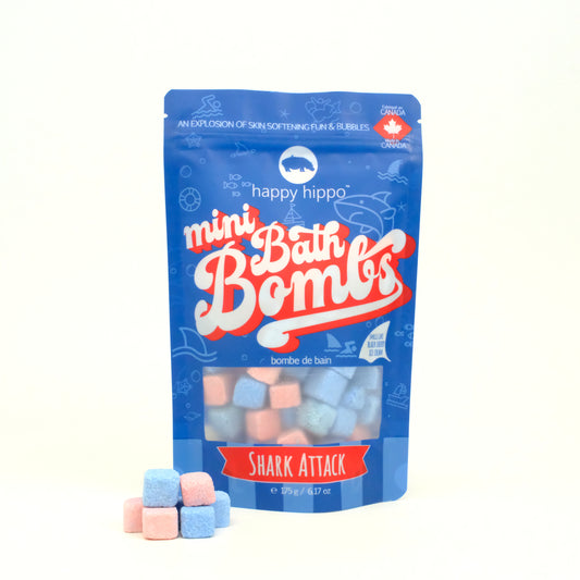 Bag of Shark Attack Mini Bath Bombs on a white background with mini bath bombs in front of it