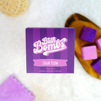 Box of Sugar Plum Bath Bombs with purple and white design on a white background