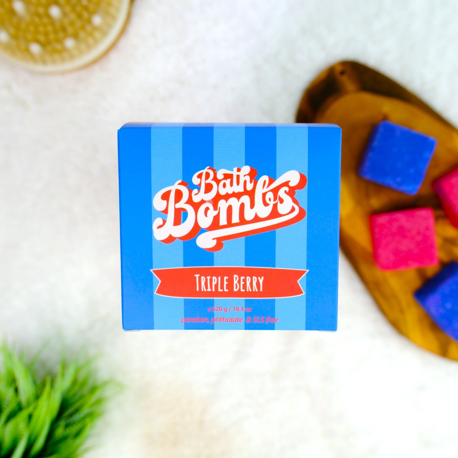 Bath Bomb packaging with colorful bath bombs on a wooden board