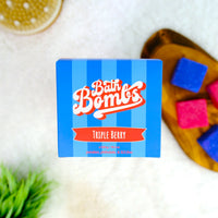 Bath Bomb packaging with colorful bath bombs on a wooden board